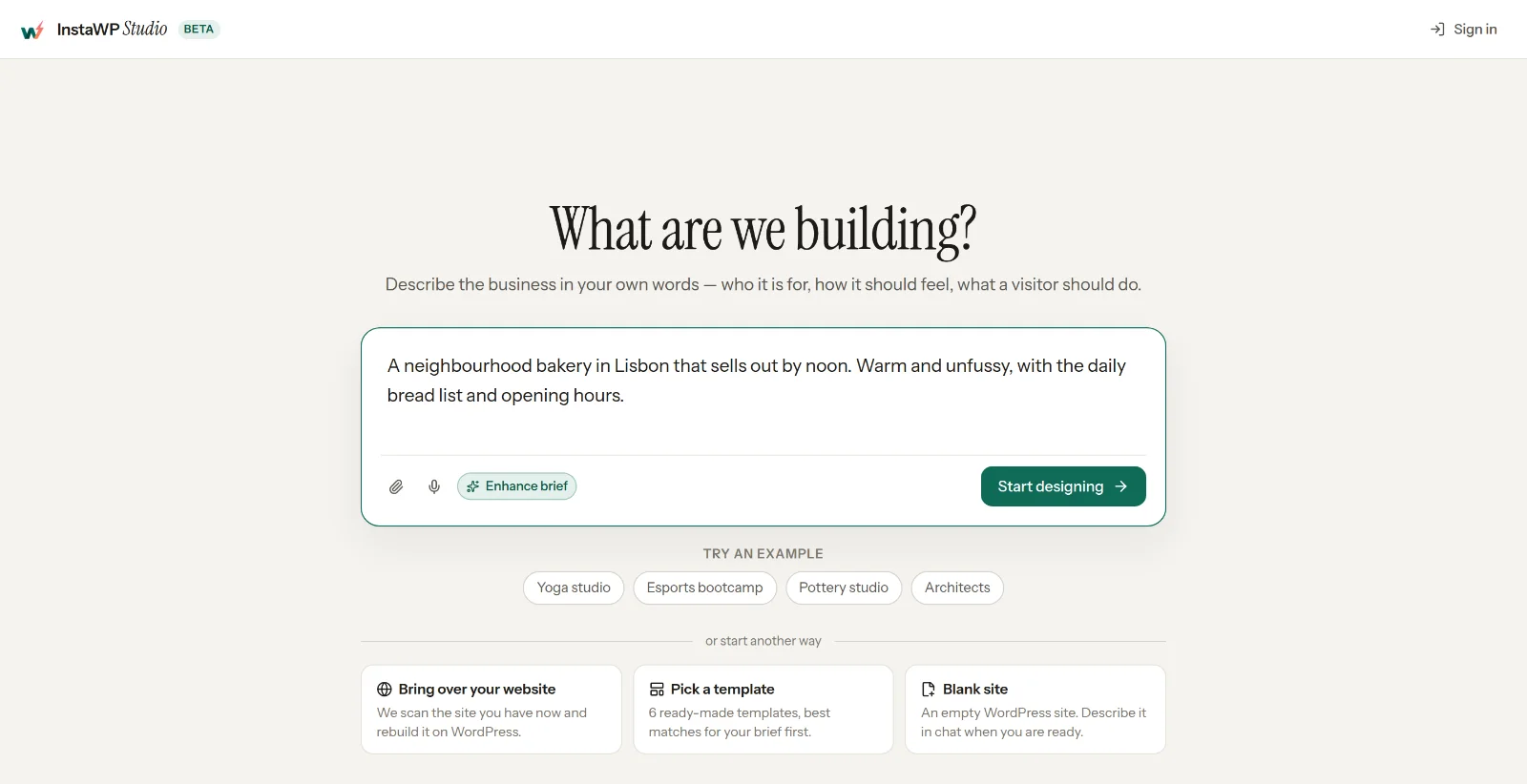 Studio's New site screen with the heading 'What are we building?', a brief for a Lisbon bakery typed into the box, and a Start designing button.
