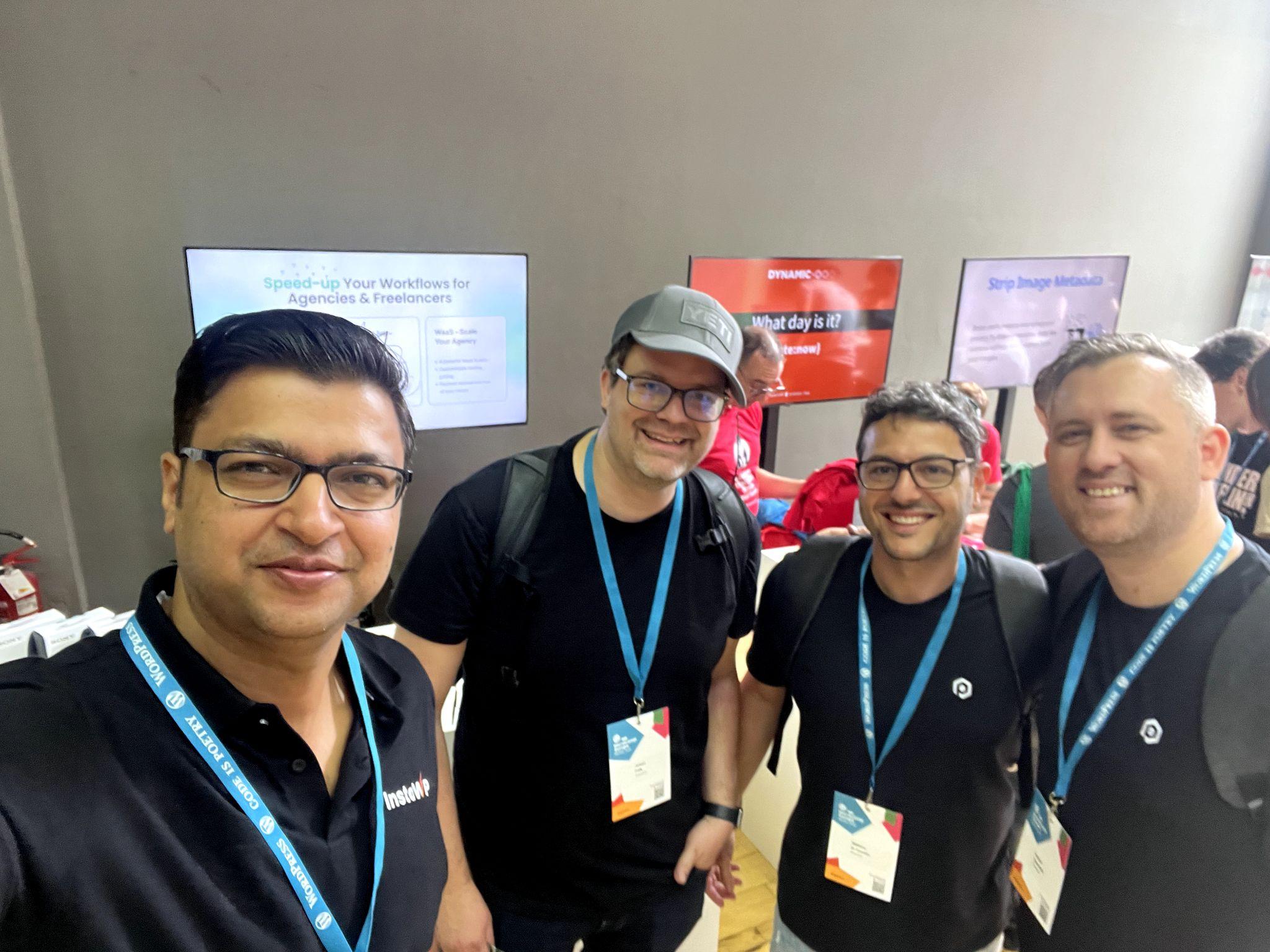 Vikas Singhal taking selfie with booth visitors. Vikas Singhal taking selfie with booth visitors.