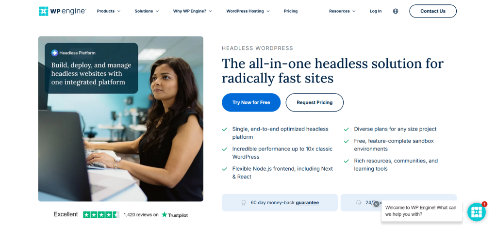 A woman working at a computer with promotional content for the WP Engine headless website platform displayed on the screen.