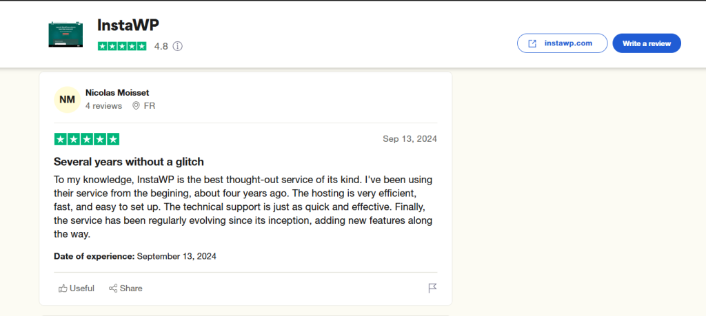 Screenshot of a positive review for InstaWP by Nicolas Moisset with a 5-star rating, highlighting the company's efficiency, quick technical support, and continuous improvement.