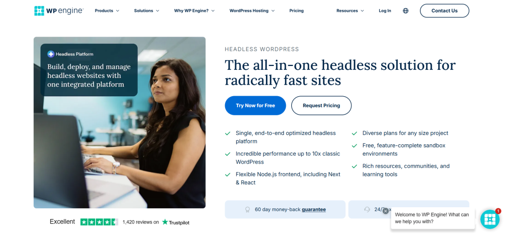 A professional woman interfacing with a computer in an office environment, with promotional information about WP Engine's headless WordPress hosting solutions displayed on the screen.