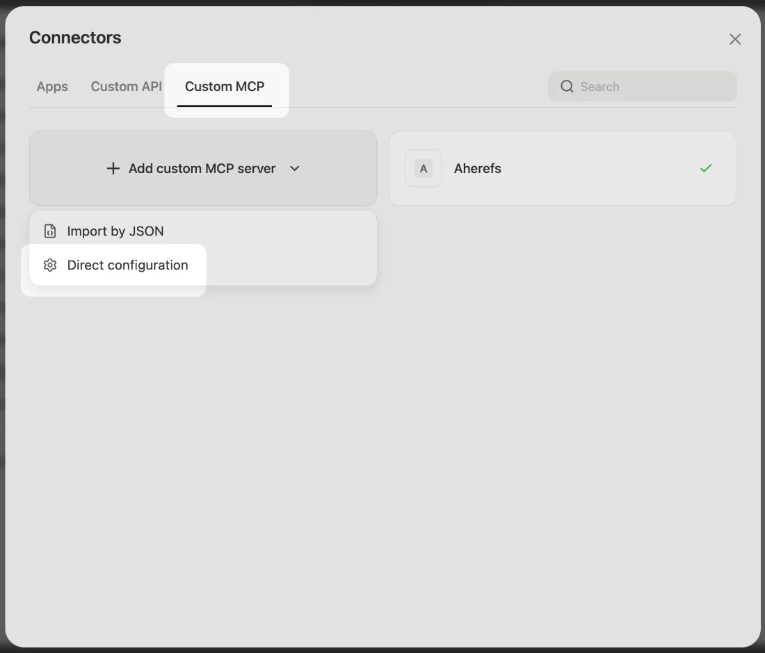 The Manus Connectors dialog on the Custom MCP tab, with the Add custom MCP server menu open on Import by JSON and Direct configuration.